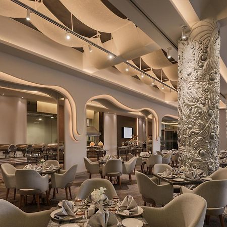 Mirage Hotel & Conference Center Alexandria Exterior foto The restaurant
